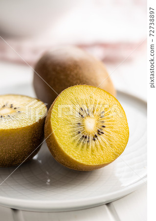 Halved ripe yellow kiwi fruit. Halved ripe yellow kiwi fruit. 72738897