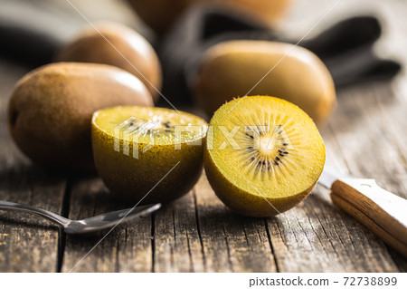 Halved ripe yellow kiwi fruit. Halved ripe yellow kiwi fruit. 72738899