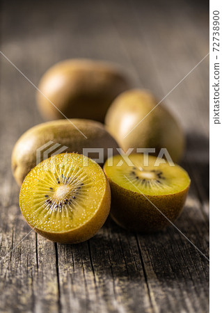Halved ripe yellow kiwi fruit. Halved ripe yellow kiwi fruit. 72738900