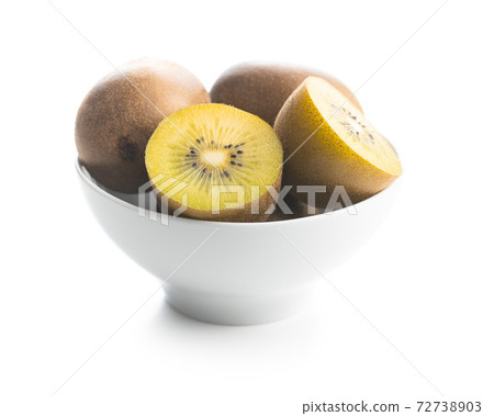 Ripe yellow kiwi fruit isolated on a white background. Ripe yellow kiwi fruit isolated on a white background. 72738903