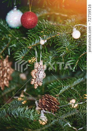 Christmas ornament on pine tree Christmas ornament on pine tree 72739516