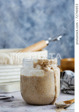 Starter sourdough. Baking homemade bread with wild sourdough and wholemeal flour. 72740953