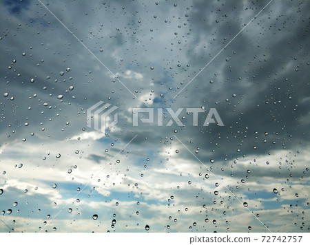 Raindrops on glass. Rainy weather. sad day. Dark sky 72742757