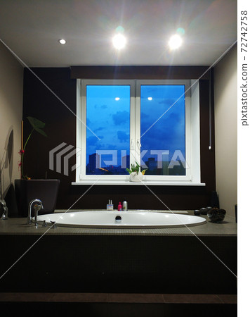 Stylish bathroom with a window. Bathroom interior 72742758