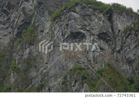 Troll Face on a Cliff of the Geirangerfjord, More og Romsdal, Norway 72743361