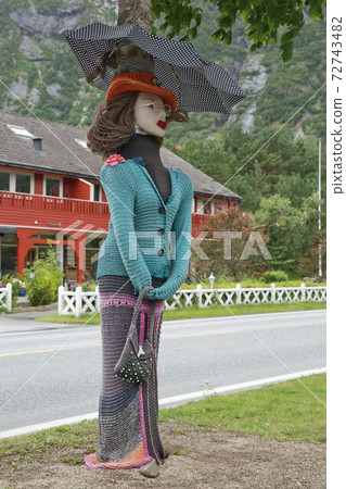The main road into town is lined with knit crochet trees. The knitting concept has a broad symbolic meaning 72743482