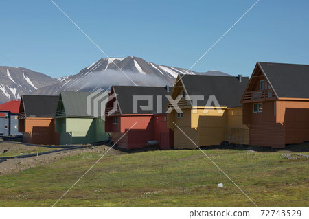 Traditional colorful wooden houses on a sunny day in Longyearbyen Svalbard 72743529