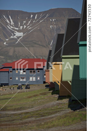 Traditional colorful wooden houses on a sunny day in Longyearbyen Svalbard 72743530