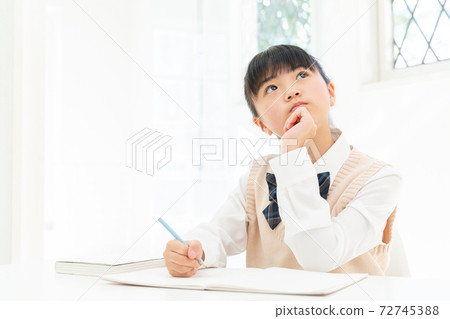 Girl in school uniform to study 72745388