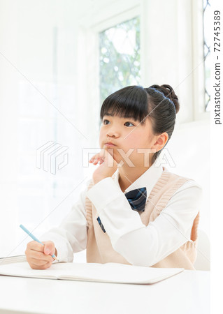 Girl in school uniform to study 72745389