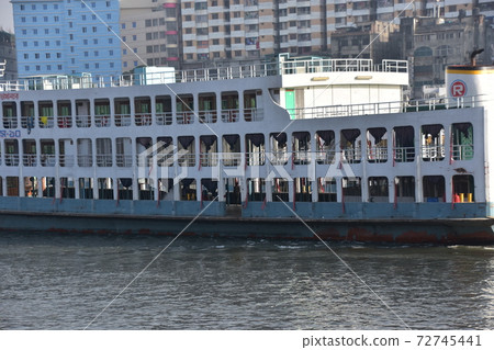 Medium-sized ship parked at Shodrugat, Dhaka, Bangladesh Retro hull and guest rooms 72745441
