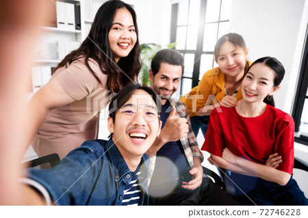 Selfie of group young man and woman team smiling having fun together 72746228