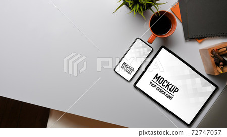 Workspace with tablet, smartphone, supplies and copy space on white table 72747057