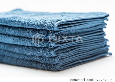 Blue face towel taken on a white background Blue face towel taken on a white background 72747888