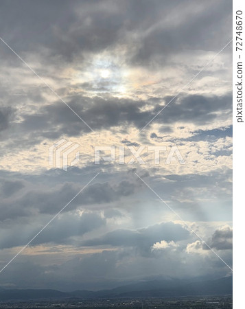 Curtain of light overflowing from clouds Curtain of light overflowing from clouds 72748670