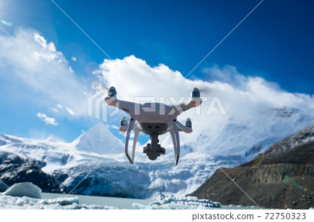Flying drone taking picture of glacier lagoon in Tibet,China 72750323