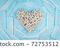 White heart on a background of a blue faces masks. Concept of a Valentines day during Coronavirus or Covid pandemic. 72753512