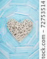 White heart on a background of a blue faces masks. Concept of a Valentines day during Coronavirus or Covid pandemic. 72753514