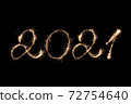 2021 New Year inscription with sparklers . 72754640