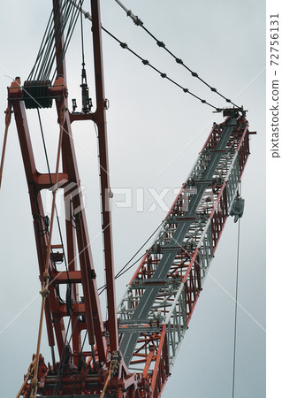 Large crane working at a construction site Large crane working at a construction site 72756131