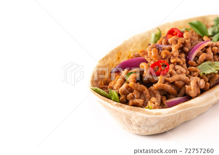 Mexican barquita taco with beef, chilli, tomato, onion and spices 72757260