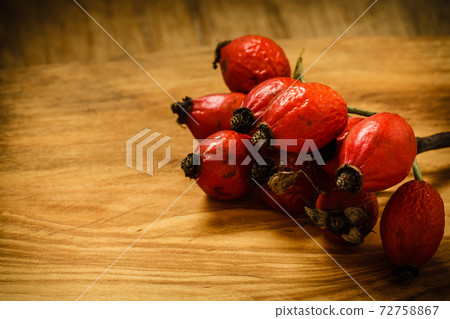 Hawthorn on wooden table background Hawthorn on wooden table background 72758867