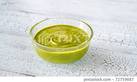 Bowl of pistachio butter 72759087