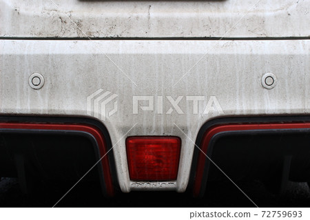 Muddy car body after a snowy or rainy day 72759693