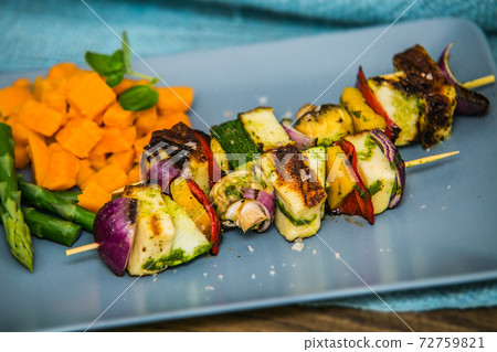 Grilled skewer with vegetables and mushrooms on plate with asparagus Grilled skewer with vegetables and mushrooms on plate with asparagus 72759821