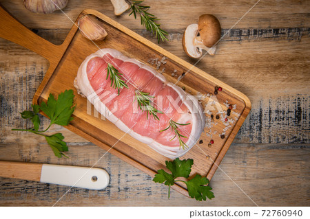 Raw veal meat on wood background Raw veal meat on wood background 72760940