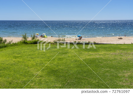 Resort luxury beaches, golf courses with palm trees, overlooking the sea for tourists to relax. 72761097