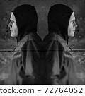 twin hooded figures 72764052