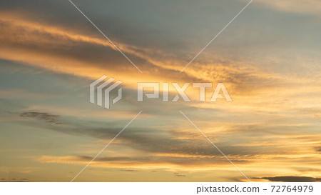 Dramatic clouds at sunset with cityscape silhouette. Abstract season weather vacation time. 72764979