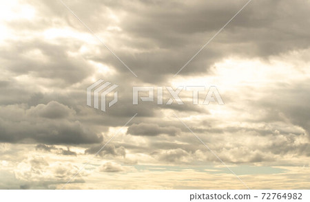 Stratocumulus cold in golden hours. Sunlight through clouds. Abstract season weather vacation time. 72764982