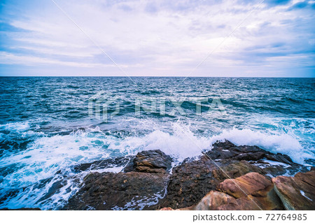 Sea with Smooth Wave and Rock landscape. Nature of Seascape in vacation holiday travel relax time. Sea with Smooth Wave and Rock landscape. Nature of Seascape in vacation holiday travel relax time. 72764985