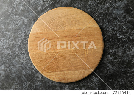 Empty wooden board on black smokey background Empty wooden board on black smokey background 72765414