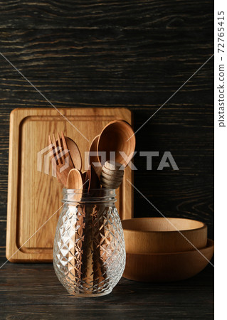 Different wooden kitchenware on wooden background, space for text Different wooden kitchenware on wooden background, space for text 72765415