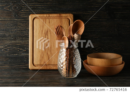 Different wooden kitchenware on wooden background, space for text Different wooden kitchenware on wooden background, space for text 72765416