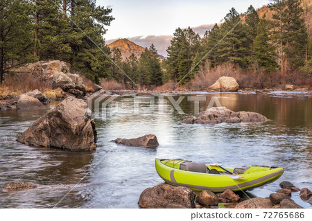 inflatable whitewater kayak on a mountain river 72765686