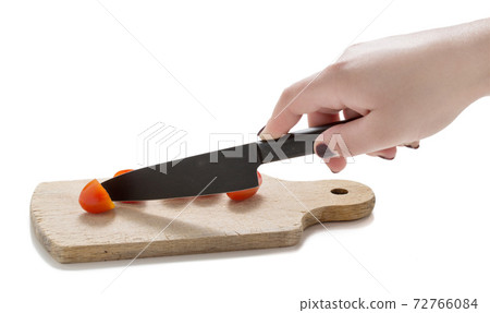 small tomatoes on a wooden cutting board with 72766084