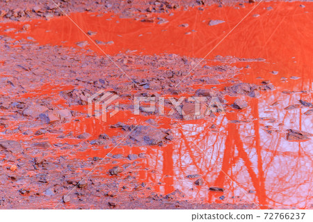 Close-up of red water polluted with iron ore waste 72766237