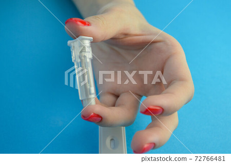 Hands of a laboratory assistant in medical gloves put a finger on cotton wool with a drop of blood, after being taken for analysis, closeup.Medical concept.Laboratory blood test.Blood sampling process Hands of a laboratory assistant in medical gloves put a finger on cotton wool with a drop of blood, after being taken for analysis, closeup.Medical concept.Laboratory blood test.Blood sampling process 72766481