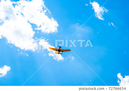 plane with spray on crops in the sky plane with spray on crops in the sky 72766654