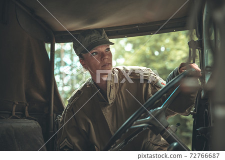 woman in a military uniform in an army car 72766687