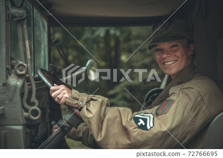 woman in a military uniform in an army car 72766695