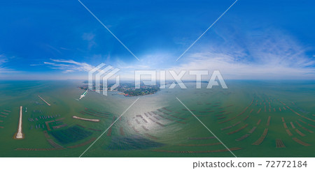360 panorama by 180 degrees angle seamless panorama of aerial view of aquaculture nets for fish farm in a lake in Sri Racha, Chonburi, Thailand. tropical beach, Andaman sea, bay island. Top view. 360 panorama by 180 degrees angle seamless panorama of aerial view of aquaculture nets for fish farm in a lake in Sri Racha, Chonburi, Thailand. tropical beach, Andaman sea, bay island. Top view. 72772184