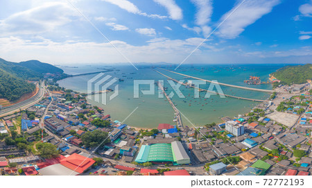Aerial view of pier with boats with container cargo ship in the export and import business and logistics international goods in ocean sea. Shipping to the harbour by crane in Pattaya harbour, Thailand Aerial view of pier with boats with container cargo ship in the export and import business and logistics international goods in ocean sea. Shipping to the harbour by crane in Pattaya harbour, Thailand 72772193