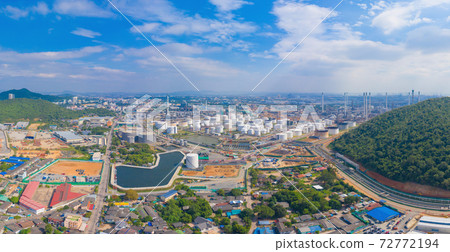 Aerial view of petrochemical oil refinery and sea in industrial engineering concept in Laem Chabang, Chonburi province, Thailand. Oil and gas tanks industry. Modern factory. Aerial view of petrochemical oil refinery and sea in industrial engineering concept in Laem Chabang, Chonburi province, Thailand. Oil and gas tanks industry. Modern factory. 72772194