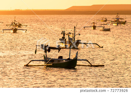The silhouette of a ship floating in the sea and the sea at sunset The silhouette of a ship floating in the sea and the sea at sunset 72773926