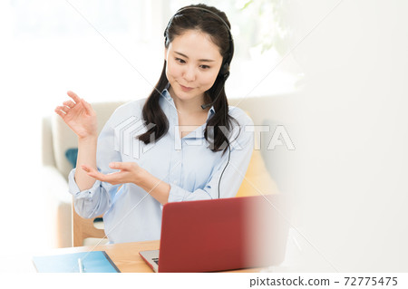 Woman making a video call 72775475